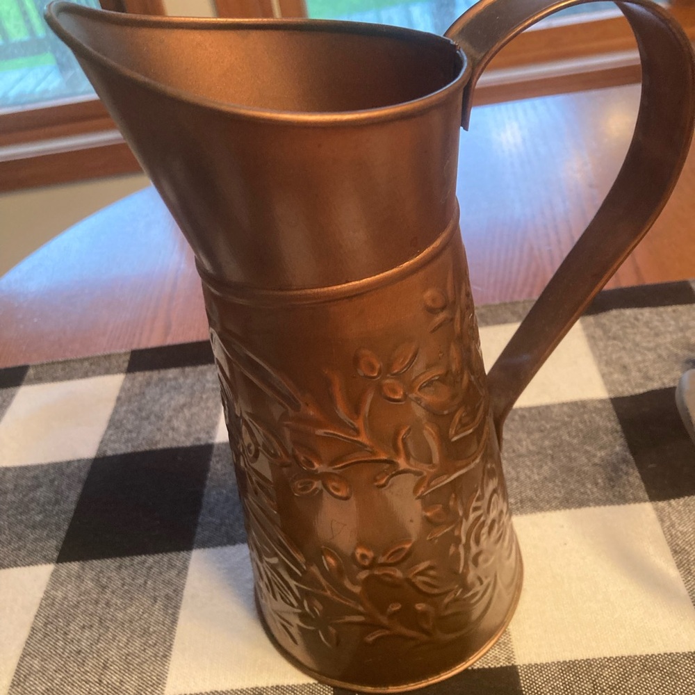 Copper colored tin decorative pitcher